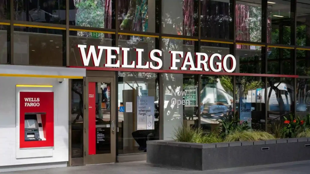 An exterior view of a Wells Fargo bank in a city.