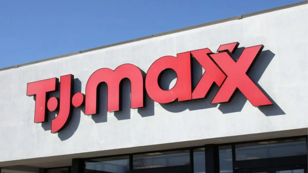 Facade of a TJ Maxx store on a commercial building with a large red and white TJ Maxx logo displayed