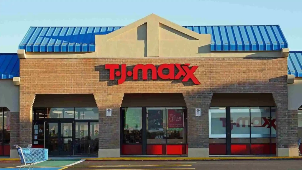 Exterior view of a TJ Maxx store during the day with a clear blue sky